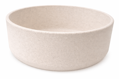 Bambū Bamboo Dog Bowl in pale taupe with a solid, subtly speckled finish and a broad, rounded shape