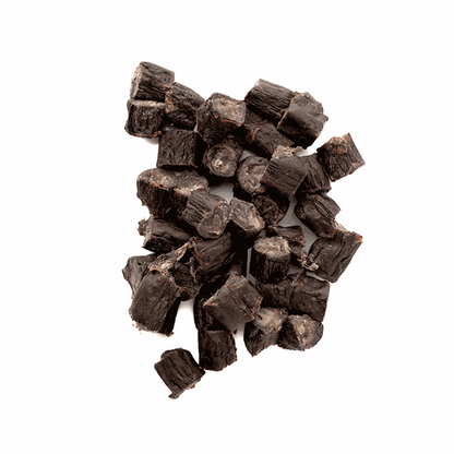Buffalo Bites (Tripe Bites) are dark brown, rough-textured natural meat treats cut into small chunky cubes.