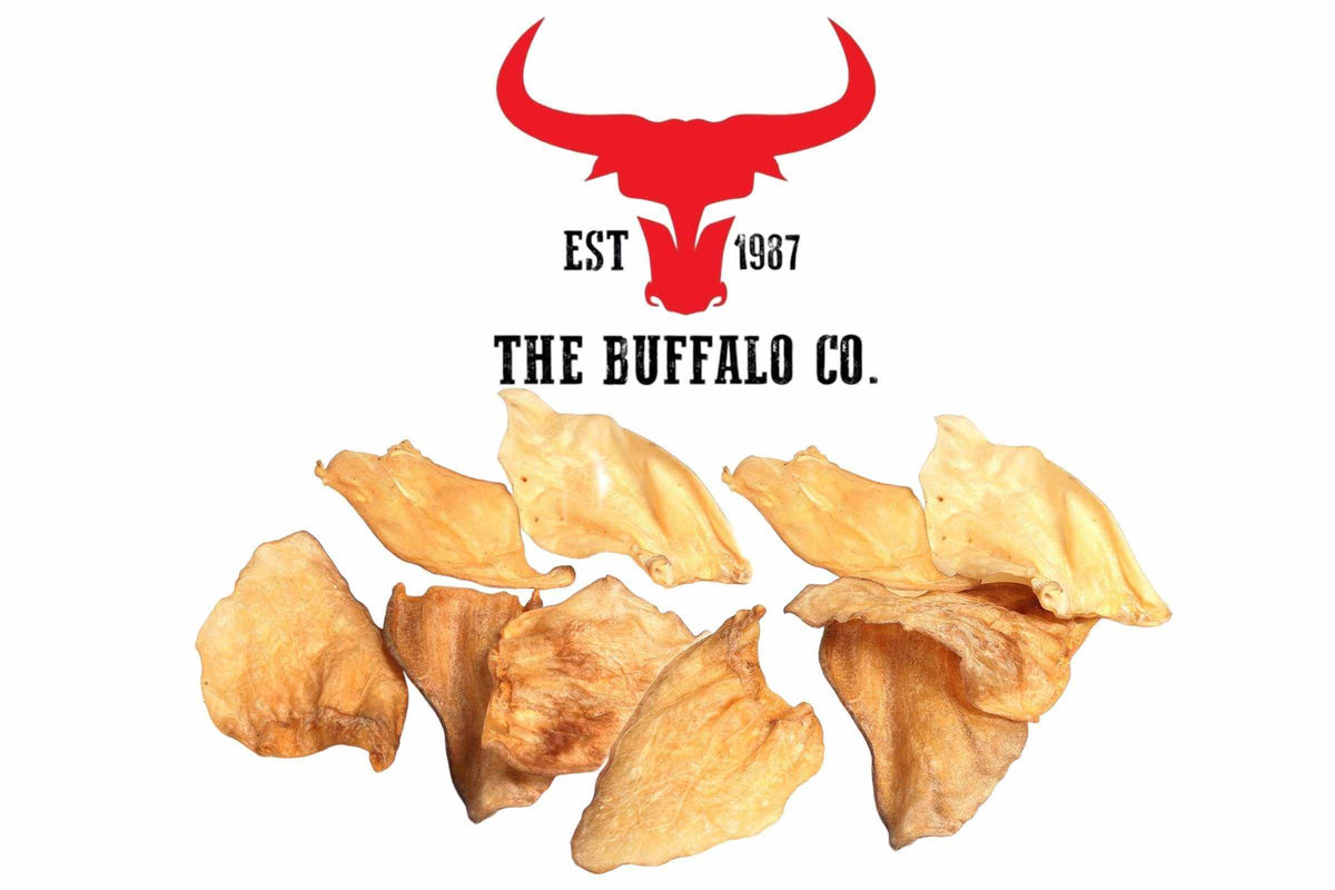 Buffalo Ears dog treats with a natural golden-brown colour, dried leathery texture and distinctive ear shapes