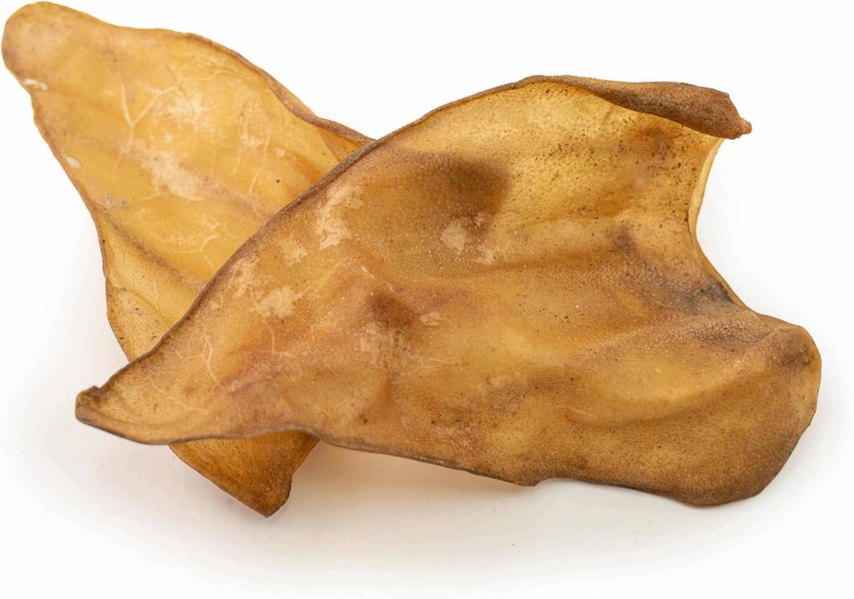 Buffalo Ears - Dog Treats, two tan dried natural chews with a wrinkled, leathery texture and curved ear shape