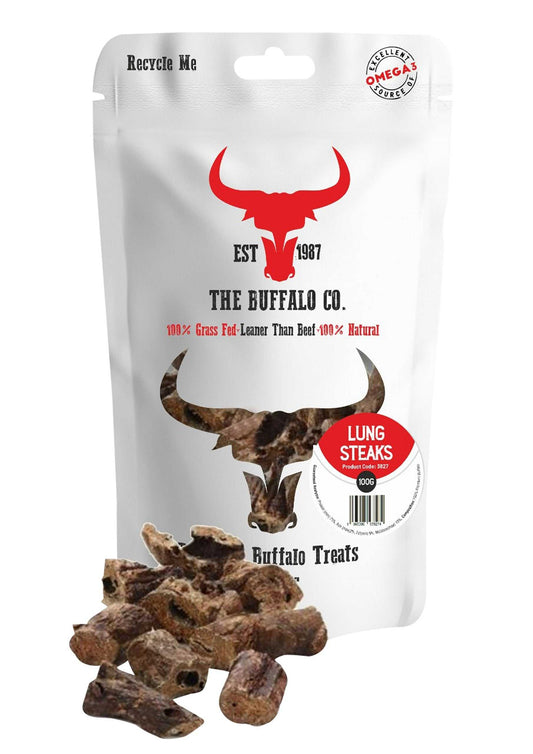 Buffalo Lung Steaks dog treats in a white recyclable pouch, with a red buffalo logo and brown, irregular dried lung pieces