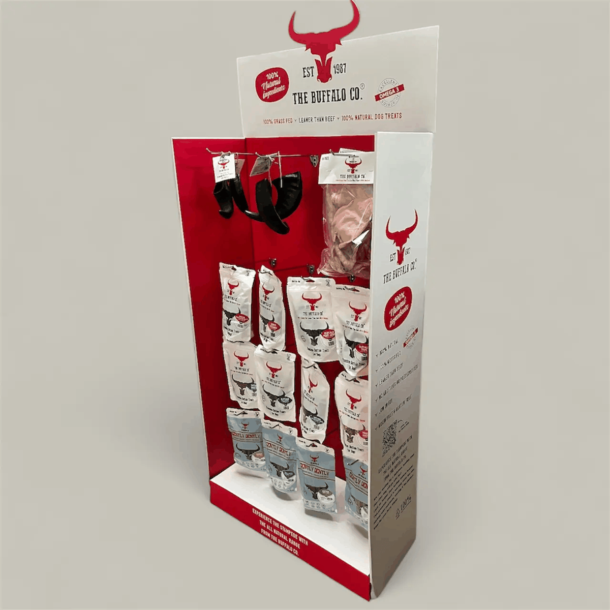 Buffalo Trade Stand Deal- with product featuring a red and white cardboard display stocked with buffalo treat bags and chews