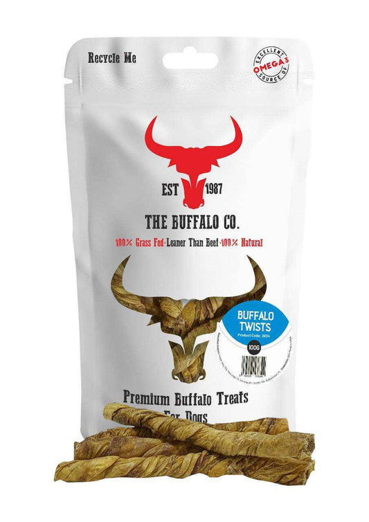 Buffalo Twists-Dog Treats in a white recyclable pouch with buffalo branding, beside several brown twisted chews