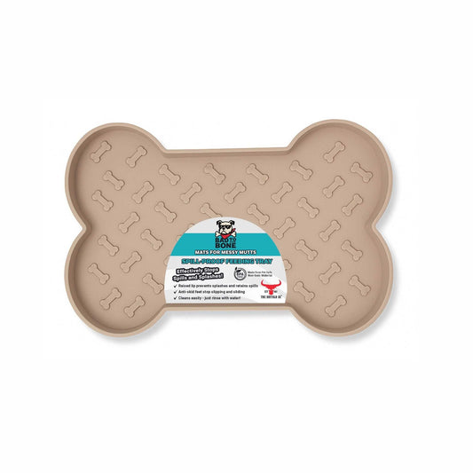 Spill-Proof Dog Feeding Mat in tan with a bone shape, raised rim and repeating bone-embossed surface