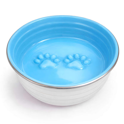 Dog bowl from The Poppy Collection with a bright blue interior, silver metal rim and raised paw print design