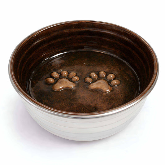 Dog bowl from The Poppy Collection with a glossy chocolate-brown interior, cream ribbed exterior and raised paw prints