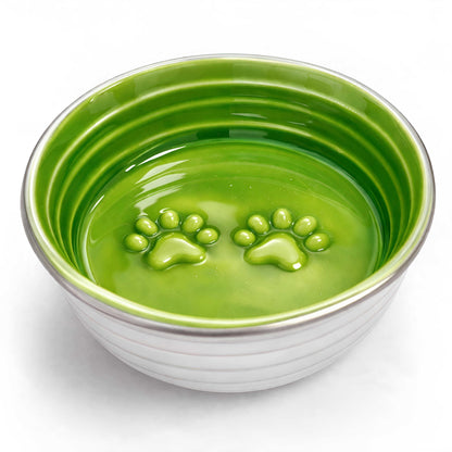 The Poppy Collection Dog Bowl in bright green glazed ceramic with a ribbed exterior and raised paw-print base