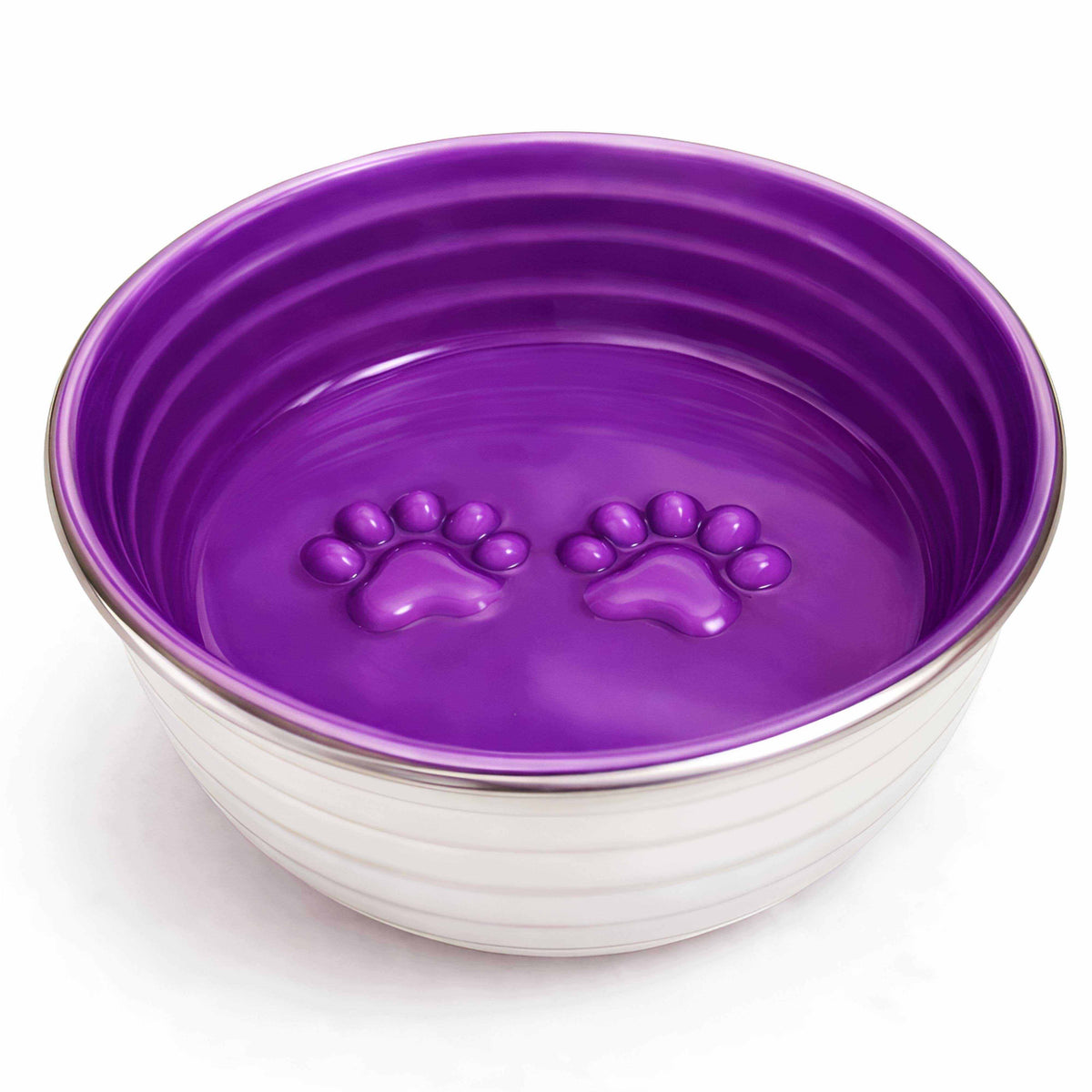 Dog bowl from The Poppy Collection with a glossy violet interior, silver rim, white ridged exterior and molded paw prints